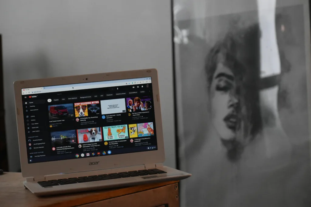 a laptop on the table showing youtube niches