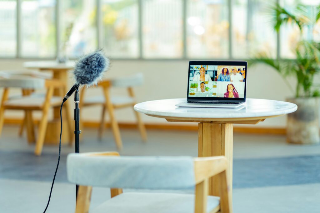 image showing a youtube chanel setup with a laptop and mic on table